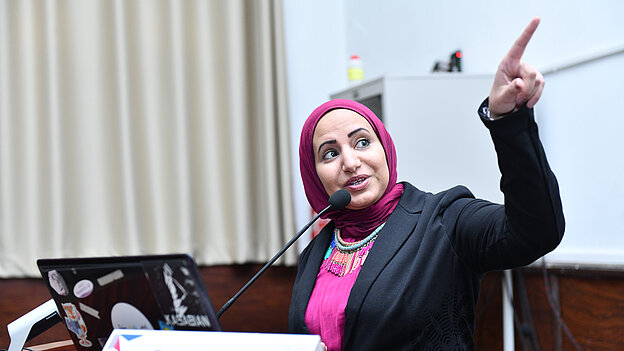Maha Nasr holding a talk