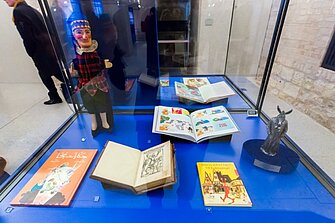Some of the books of the exhibition and a puppet