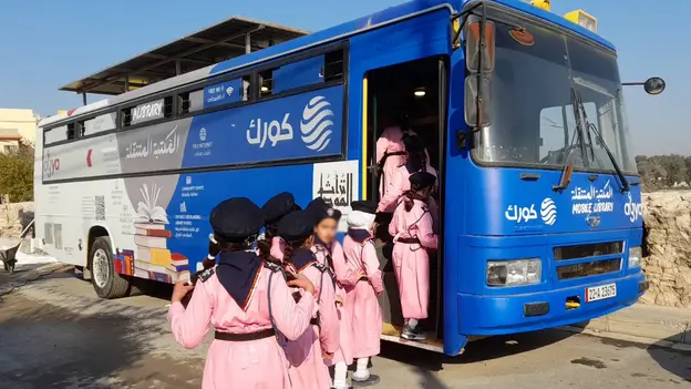 School girls visiting mobile Library