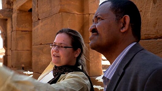 AGYA members discussion in front of cultural heritage sites in Sudan
