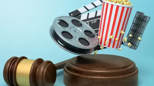Judge gravel next to a popcorn bag and a film reel